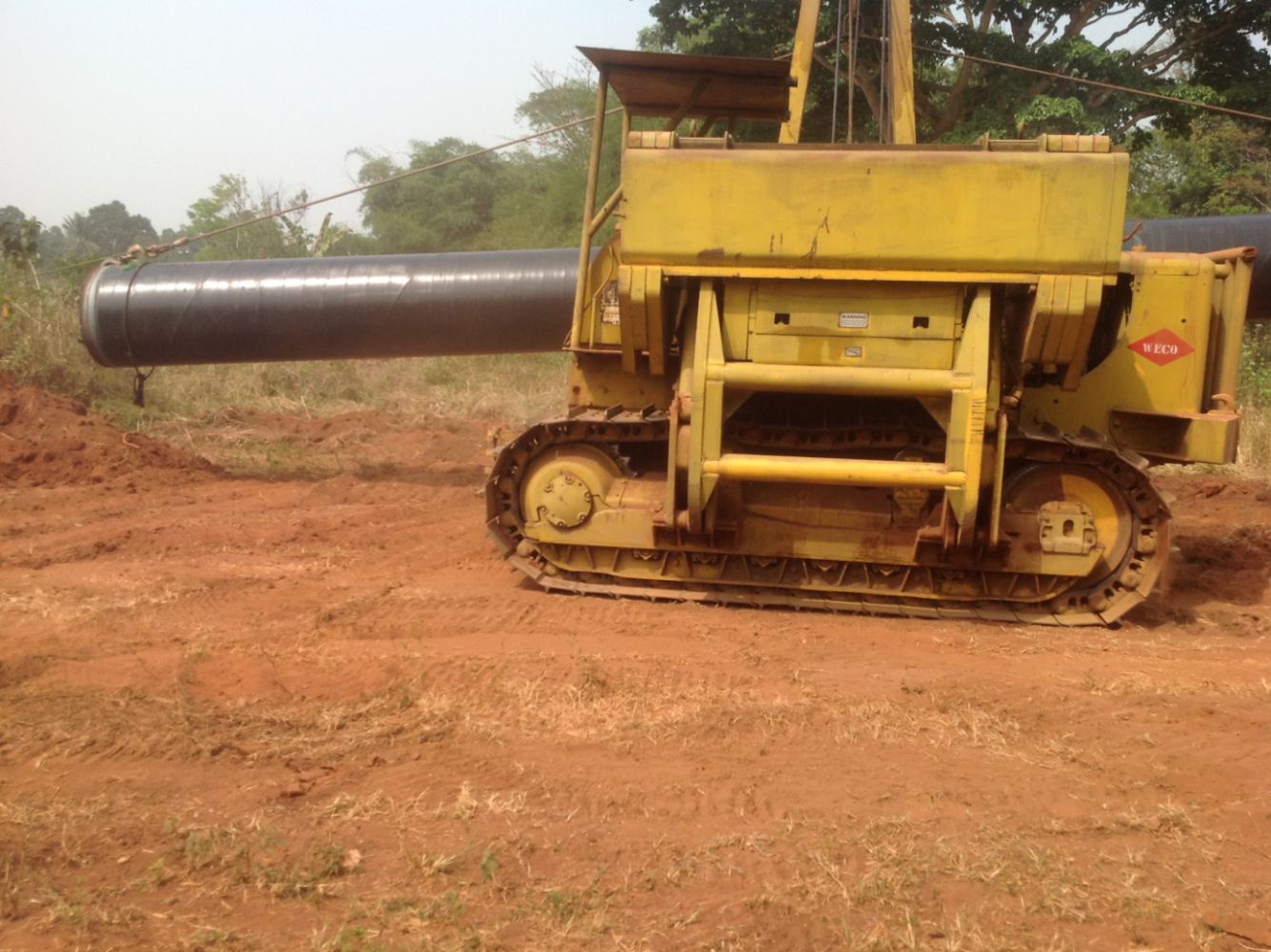 Olett side-boom pipelayer carrying a 36-inch gas pipe on the right of way